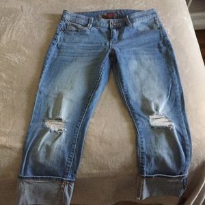 Below the knee light blue jeans